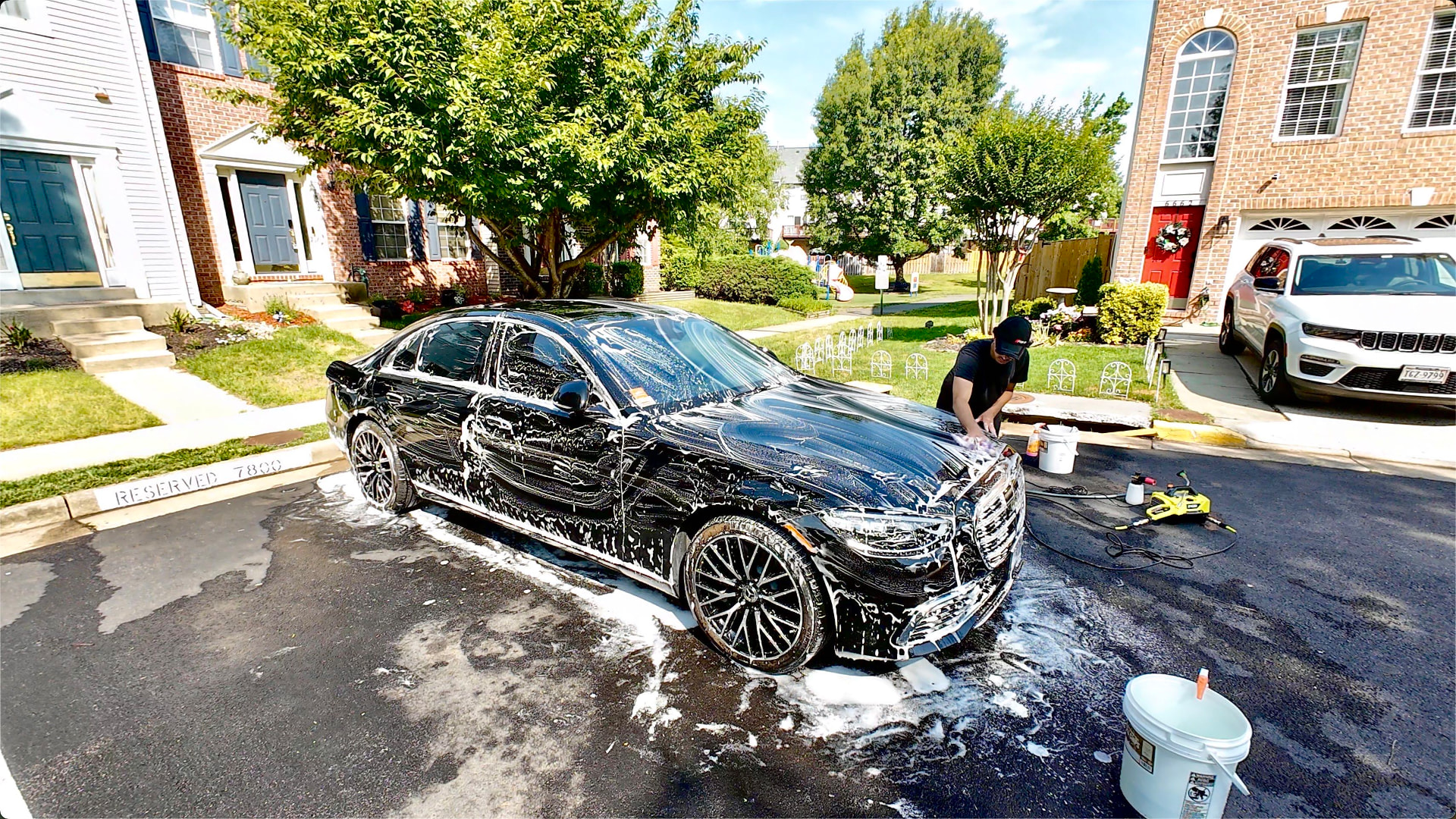 Owner performing a foam bath on a Mercedes